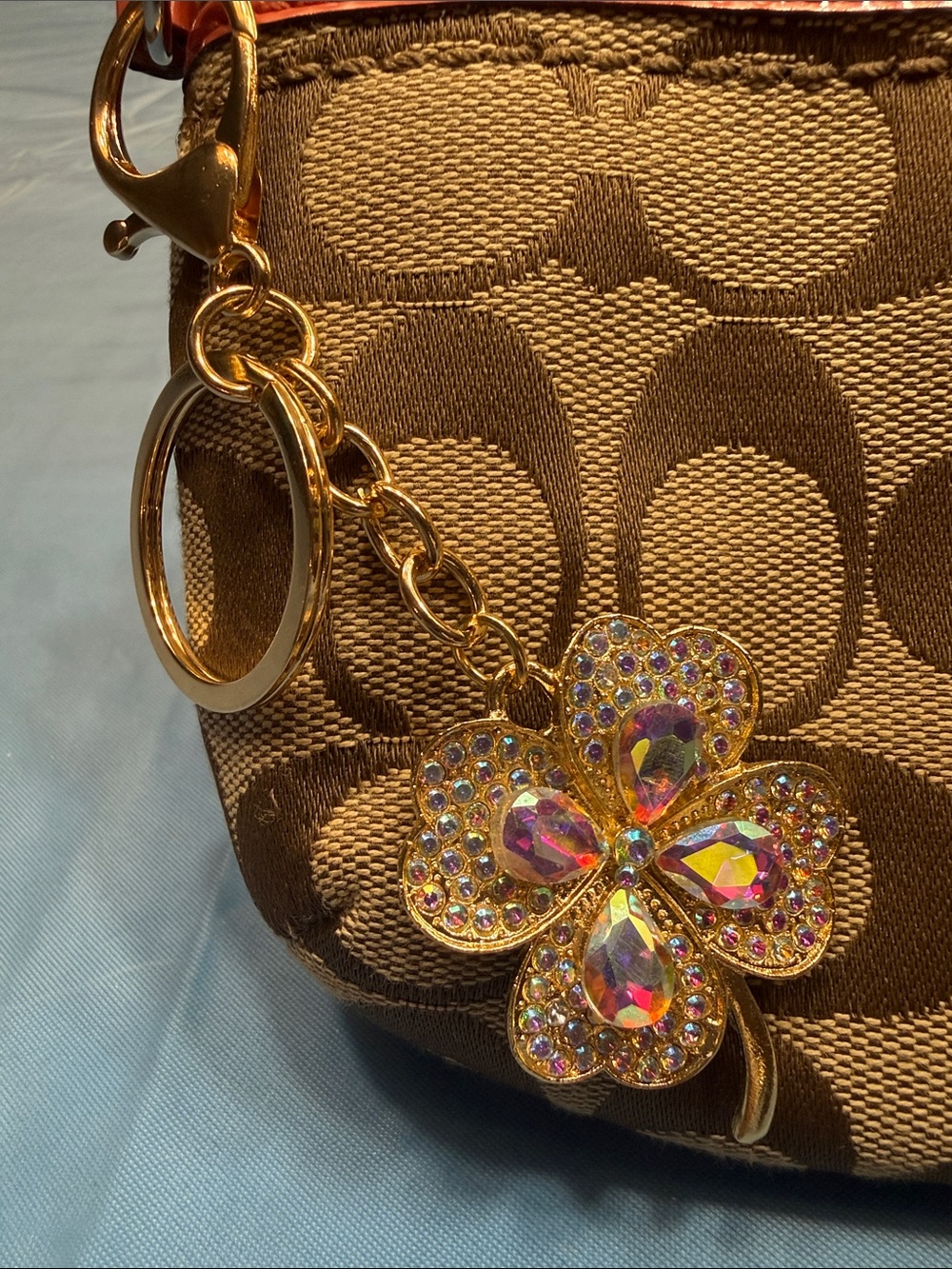 Coach Tan Signature Wristlet with Brown Trim and Coral Accent and key charm - Picture 3 of 6